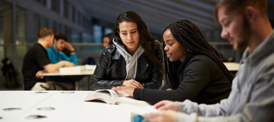 Students sat working at a desk
